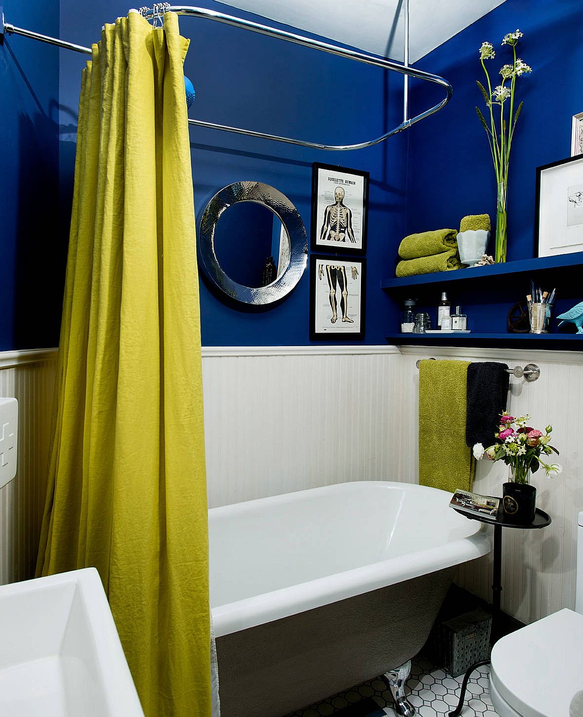 Modern eclectic bathroom in blue and white with greenish-yellow thrown into the mix