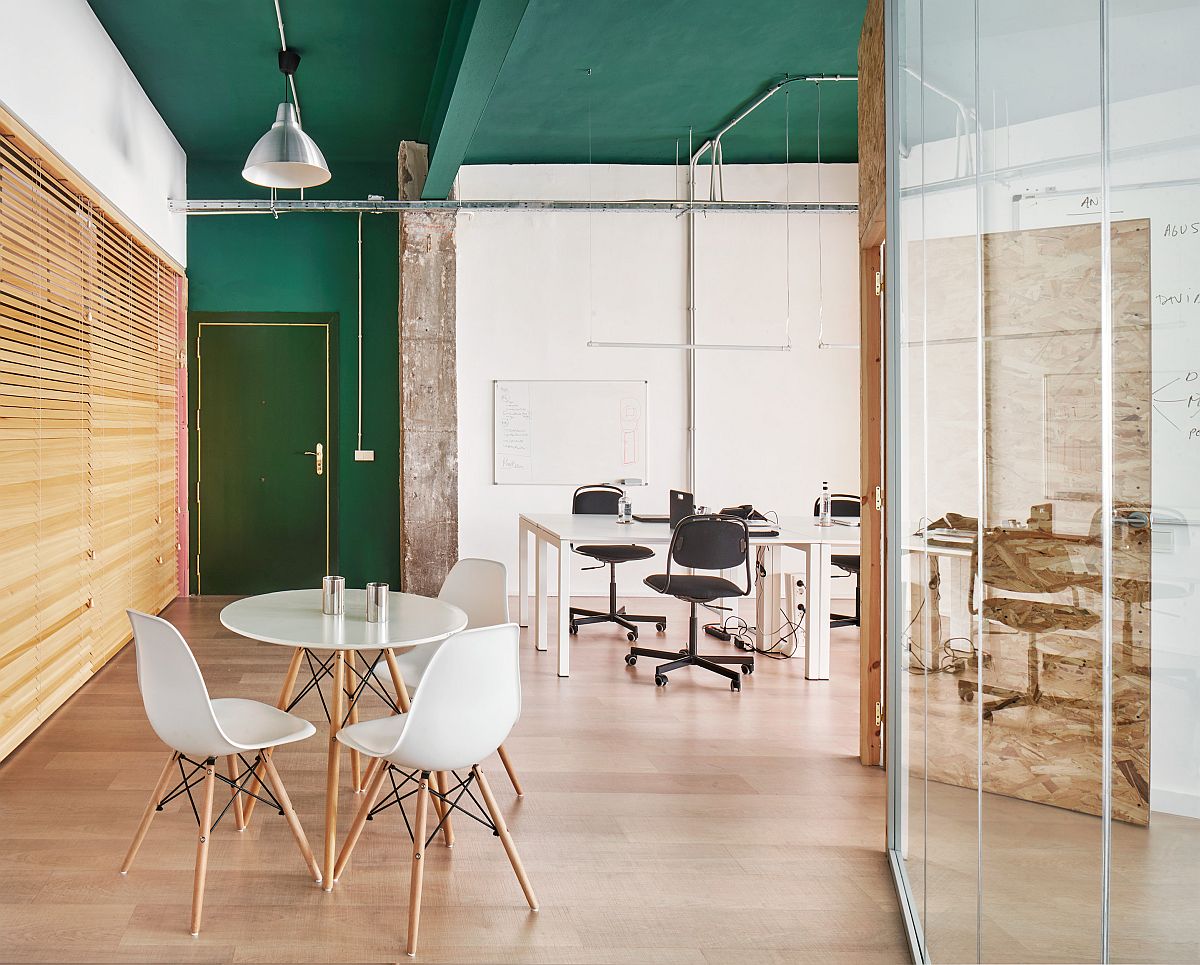 Modern industrial office with green ceiling and white decor