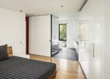 Modern-minimal-master-bedroom-of-the-single-family-home-with-wood-and-gray-floor-10515-217x155