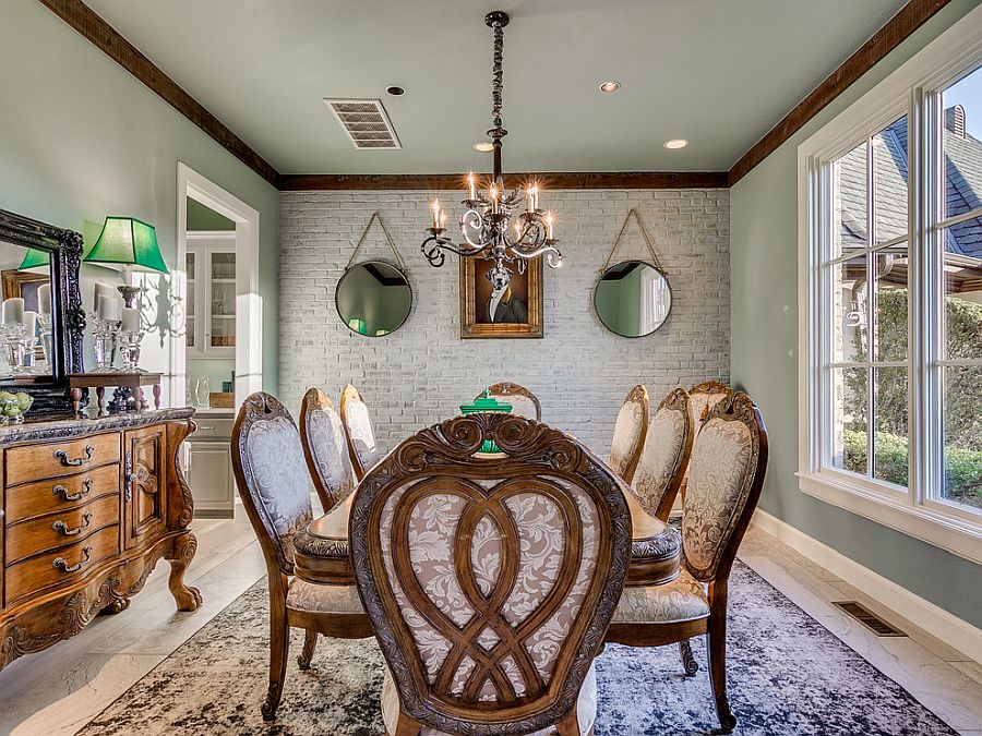 Opulent and exclusive dining room with classic decor in wood and whitewashed brick wall backdrop