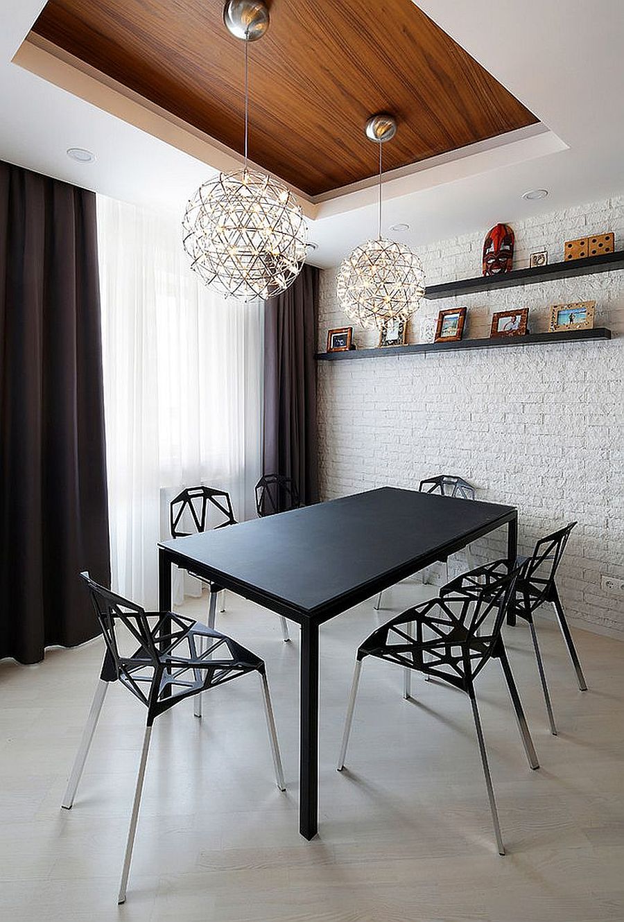 Painting the brick wall completely white works well in contemporary dining rooms