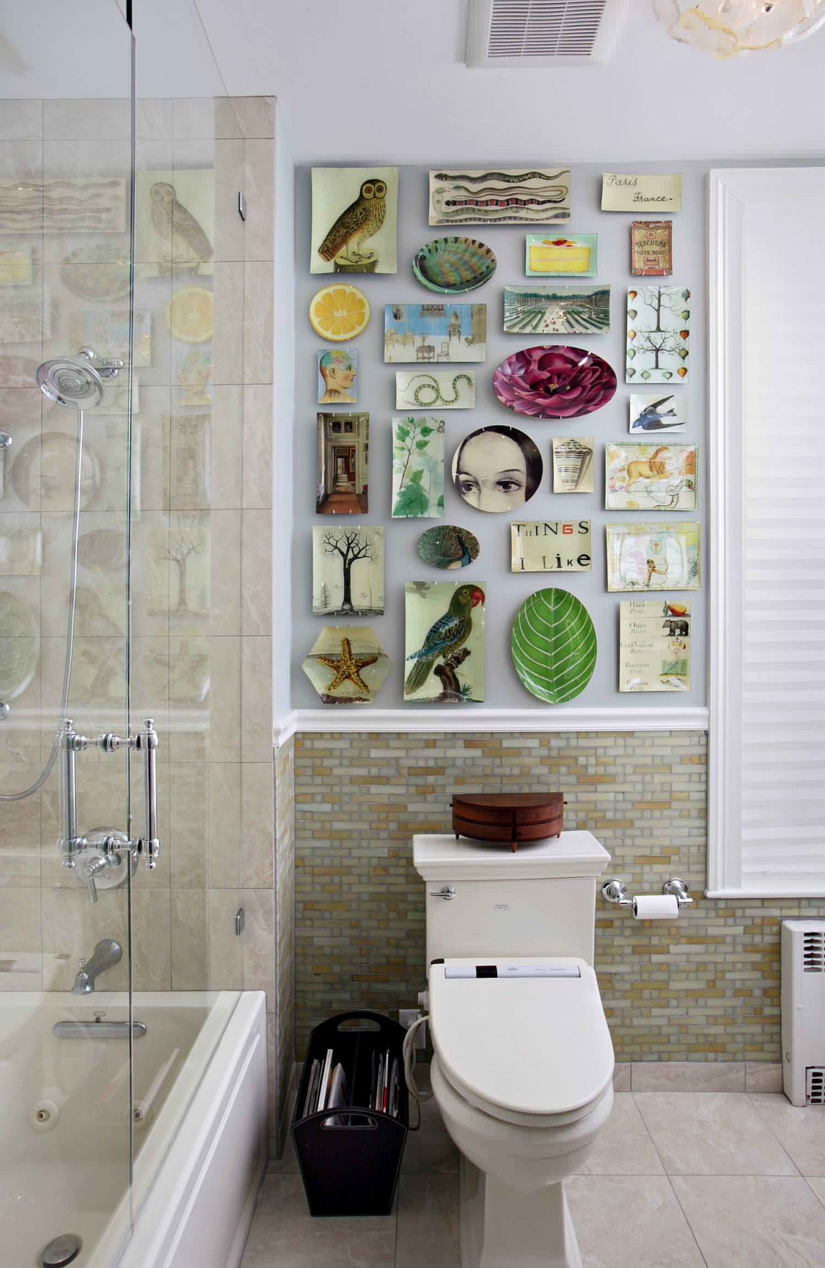 Quirky wall of decoupage plates becomes the focal point in this revamped modern bathroom