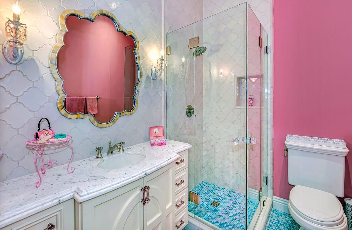 Reflection of the accent wall in the bathroom adds to the pink aura inside