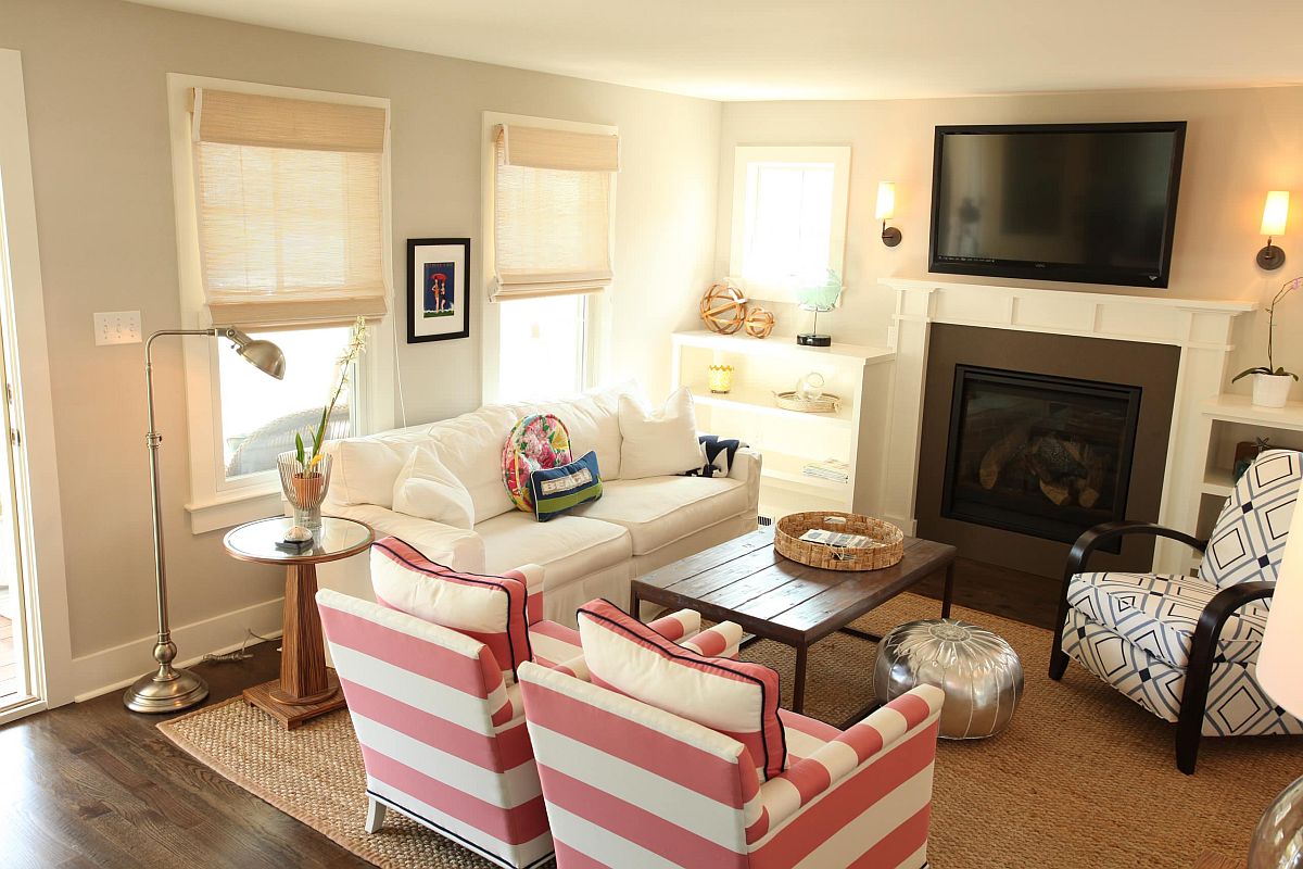 Relaxing and pleasant coastal style living room with striped chairs in pink