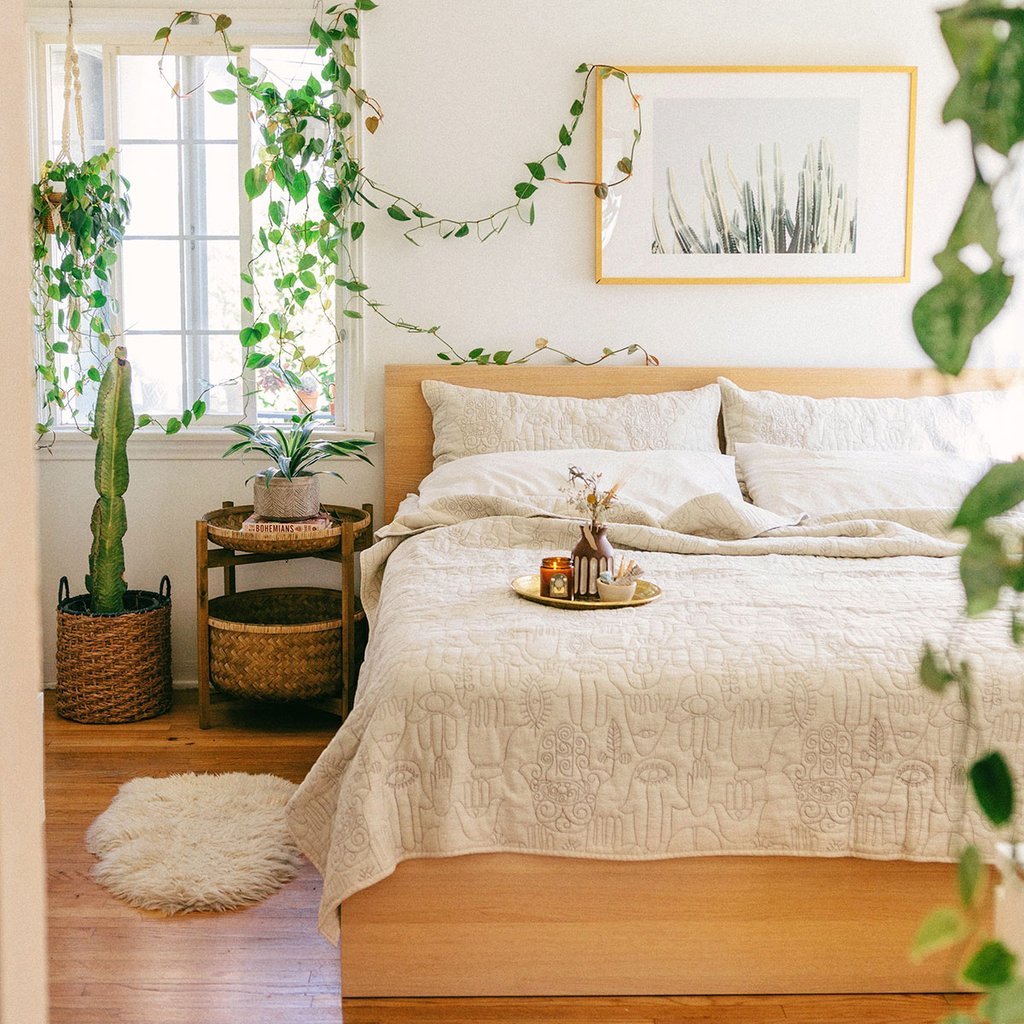 Relaxing bedroom with an abundance of houseplants