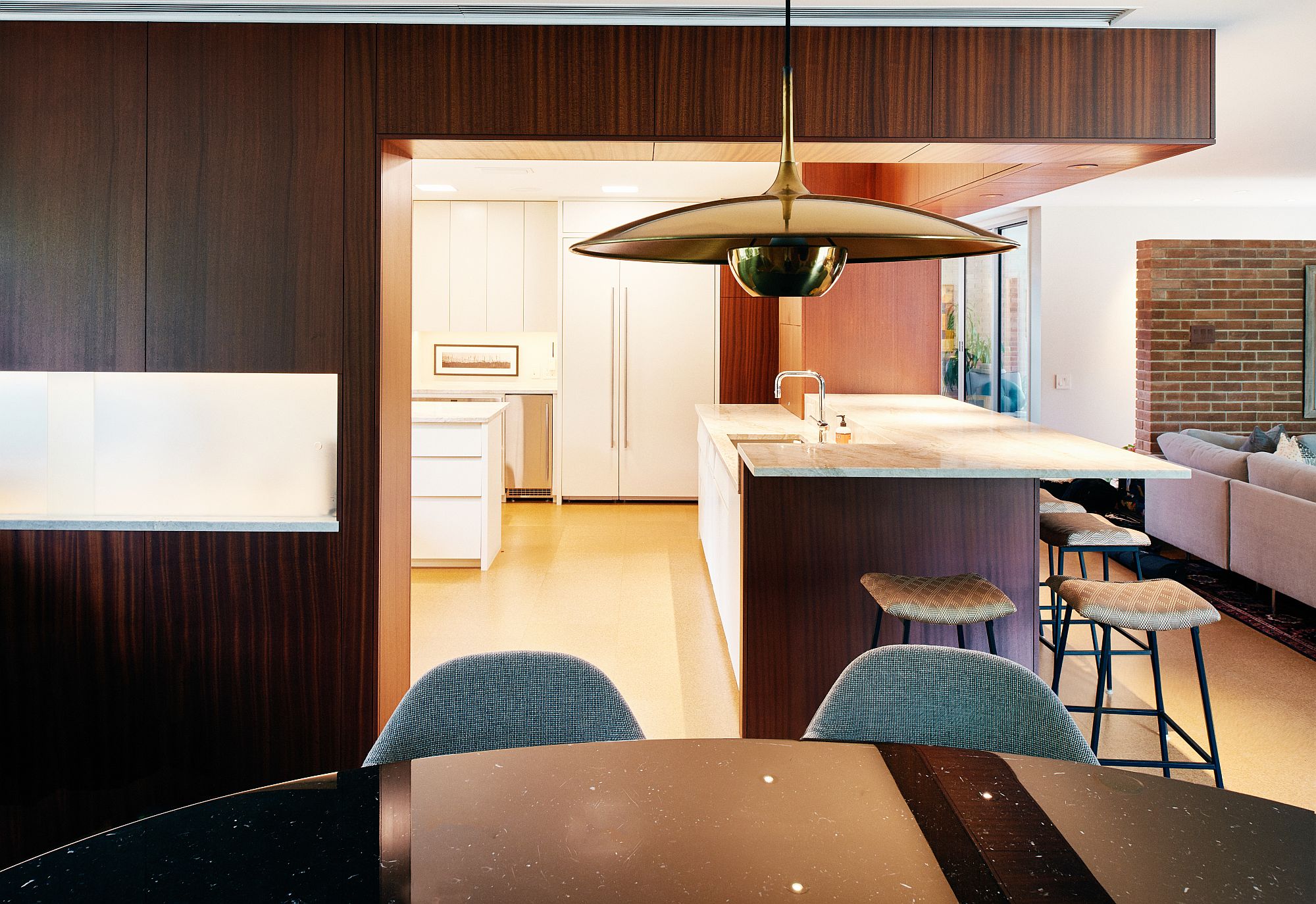 Revamped kitchens with honed-quartzite countertops, white cabinetry and cork flooring