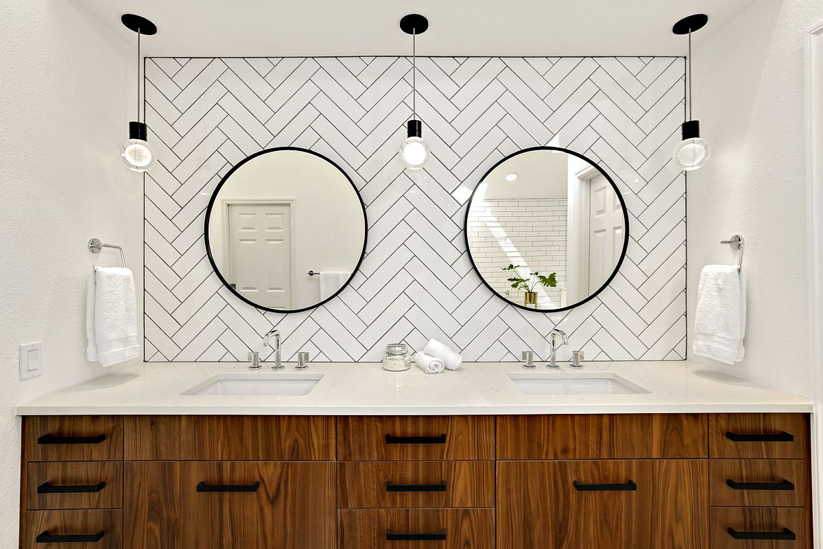 Simple Edison bulb lighting and custom backdrop for the polished modern bathroom with walnut vanity