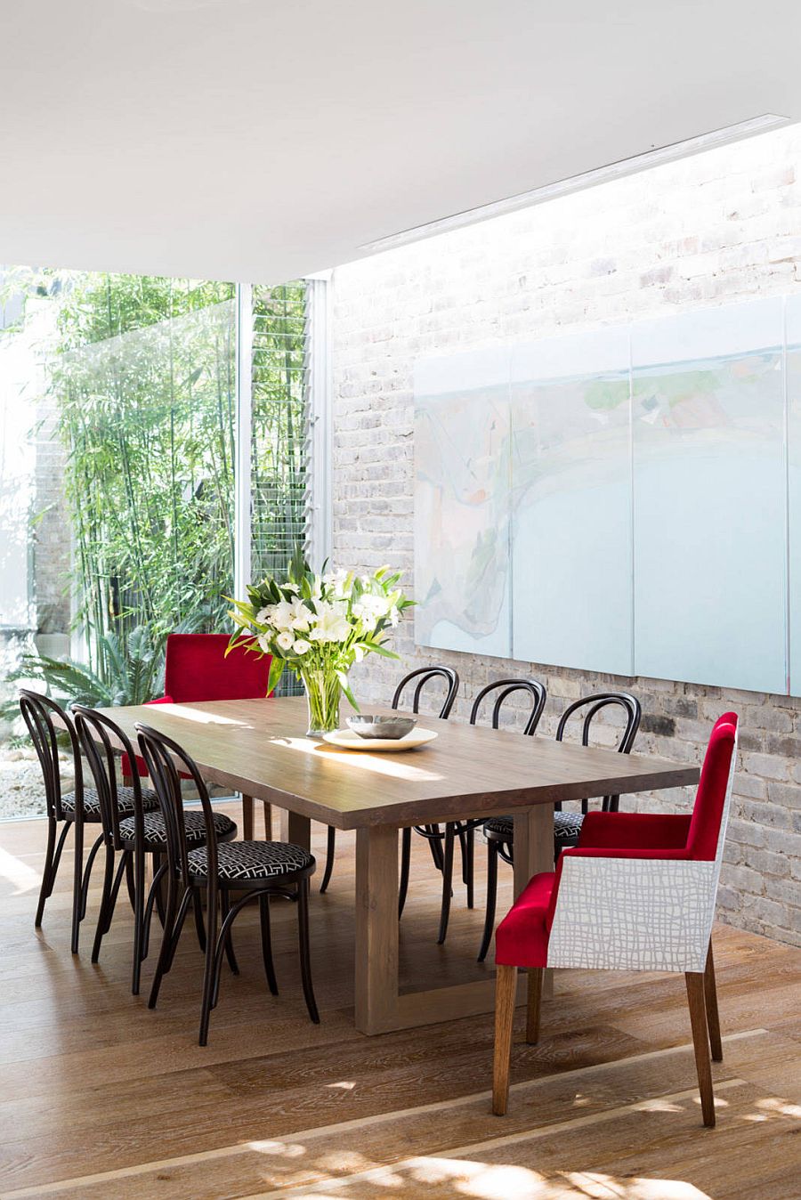 Skylight highlights the whitewashed brick wall in the backdrop in a natural fashion