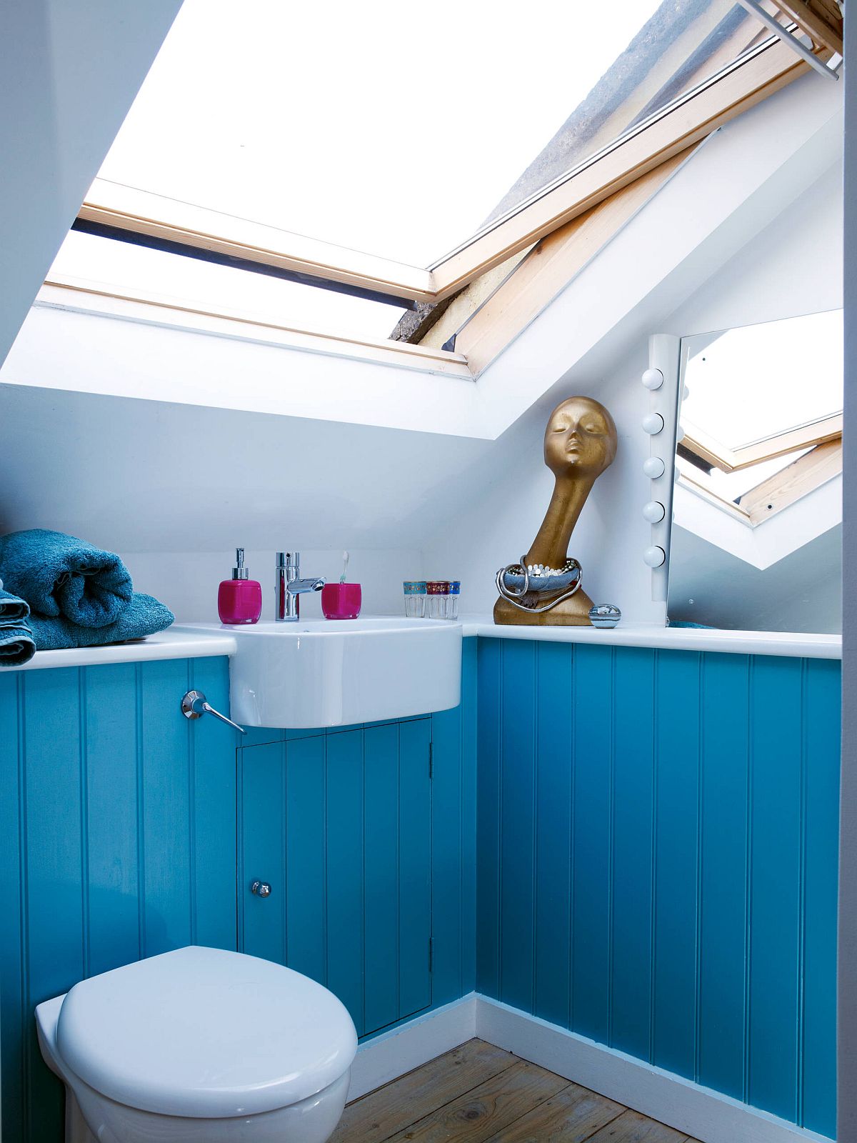 Small attic bathroom in lovely blue and white with plenty of natural light