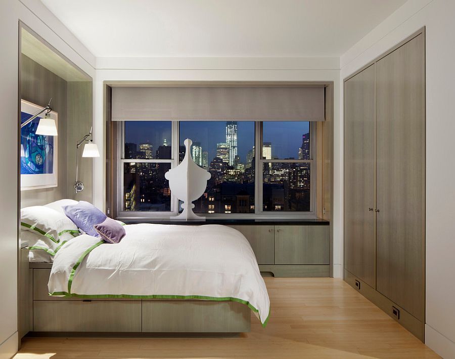 Small bedroom of apartment in The Village with views of New York City's sparkling skyline