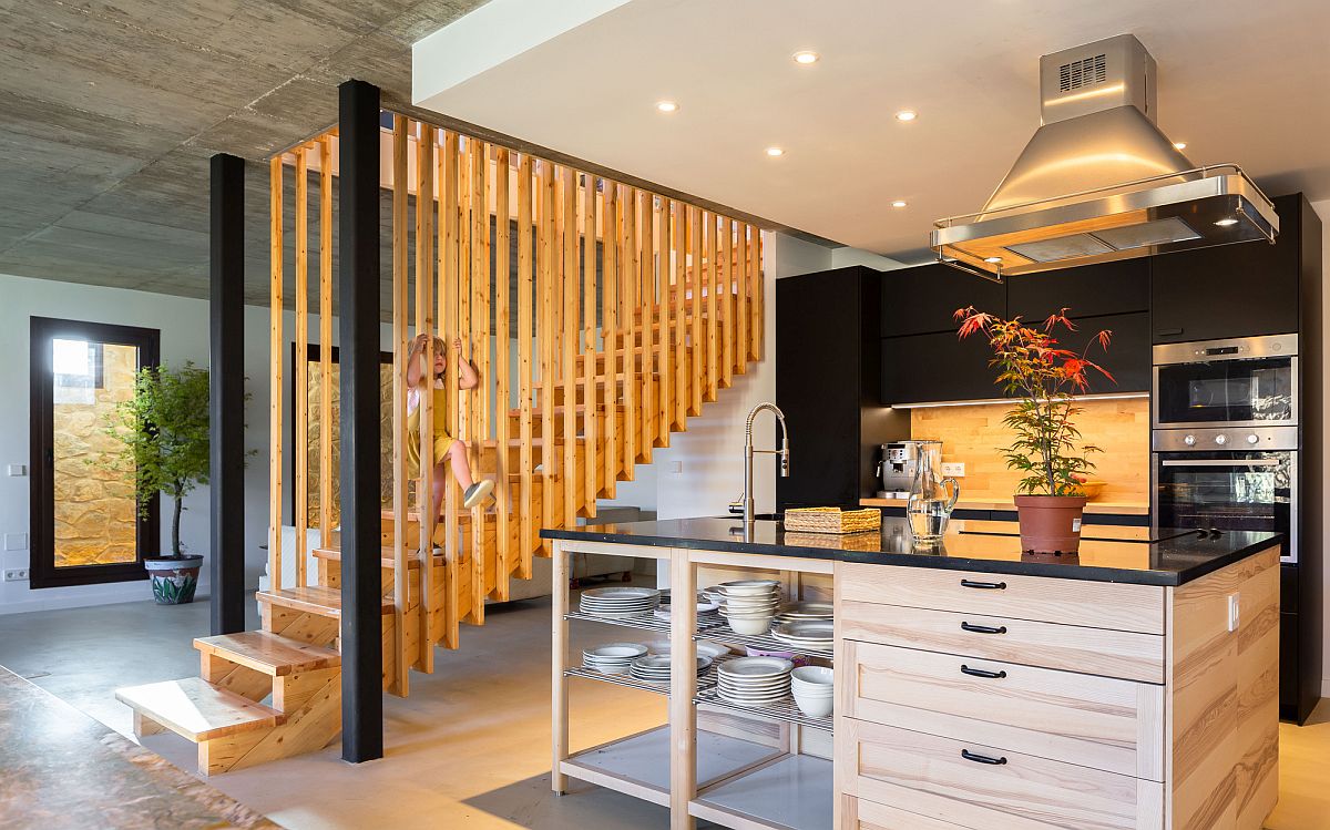 Smart-kitchen-and-a-wooden-staircase-next-to-it-inside-the-Spanish-holiday-house-17280