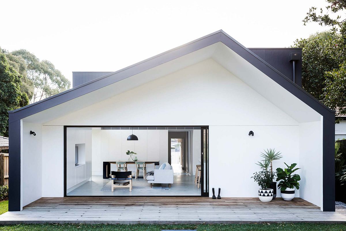 Smart shed-style design of the home in white with dark trims revamps the appeal of the Californian bungalow