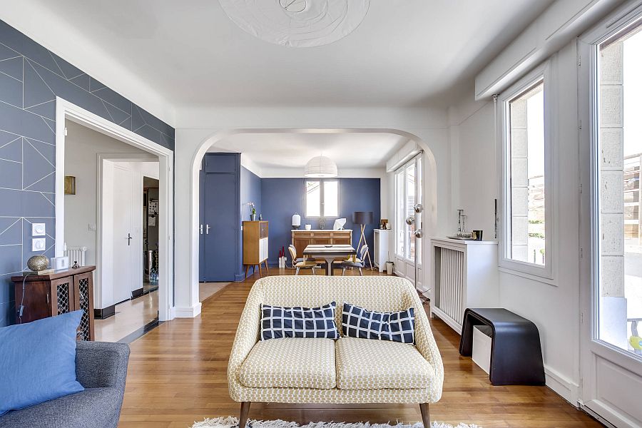 Spacious modern living room in white with dark blue accent wall