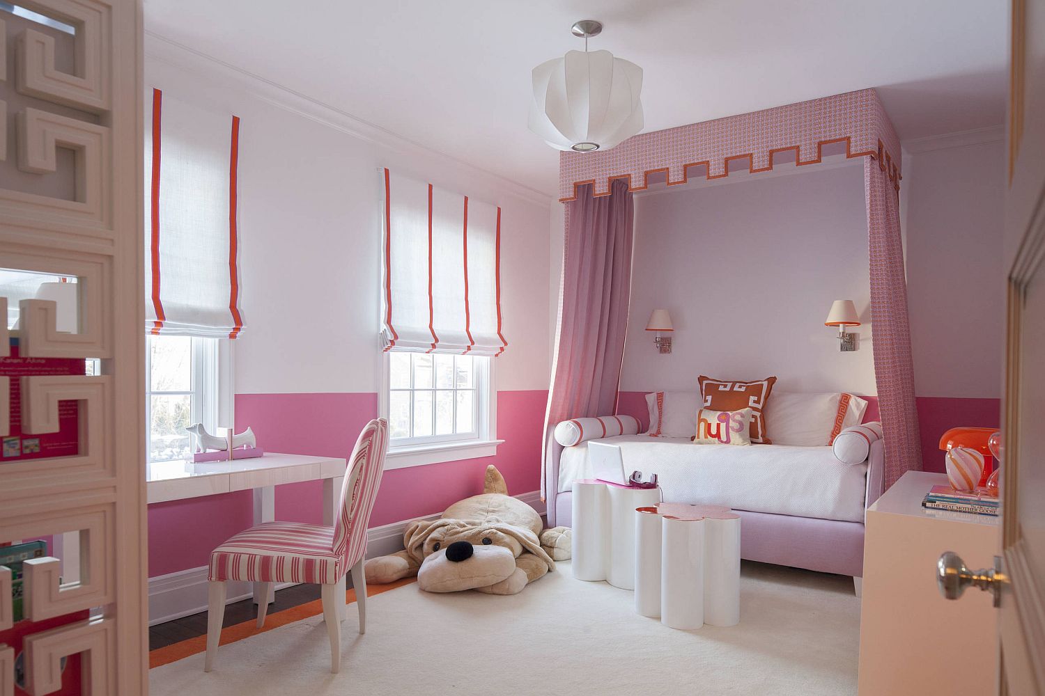 Stripes on the window covering complement the striped accent chair in pink and white beautifully