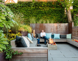 Secluded Outdoor Conversation Pit Surrounded by a Wall of Green