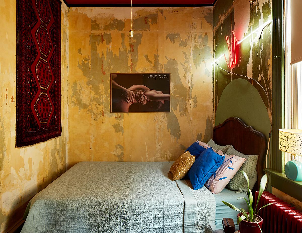 Tiny eclectic bedroom of Chicago home in yellow and green with pops of red