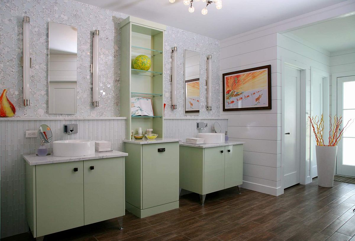 Vanity and open shelves in light pastel green for he white bathroom with wooden floor