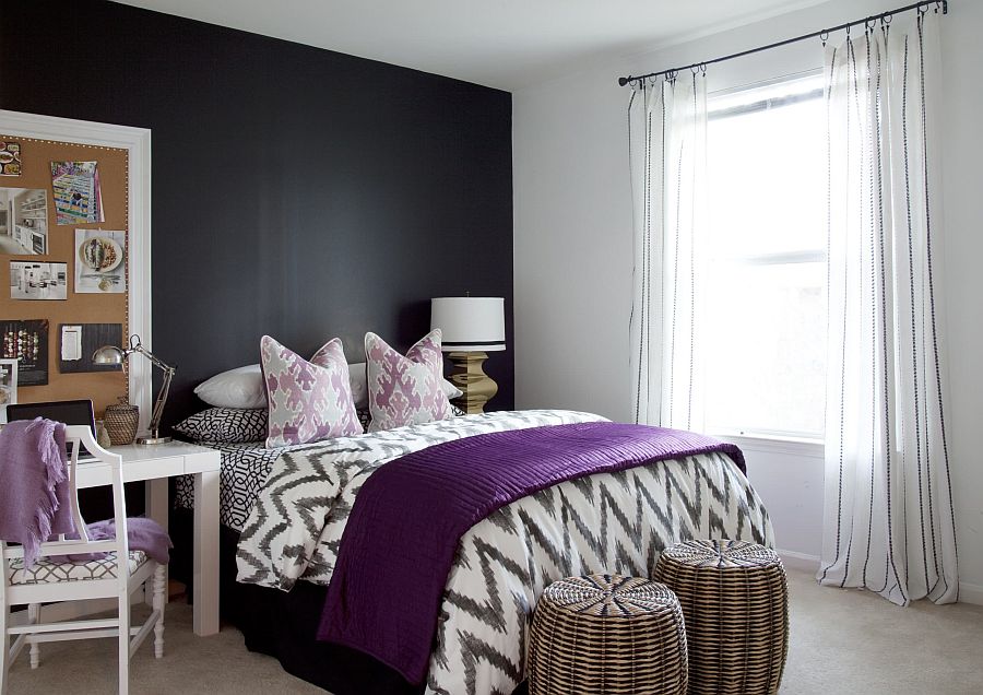 White bedroom with dark gray accent wall and purple accents