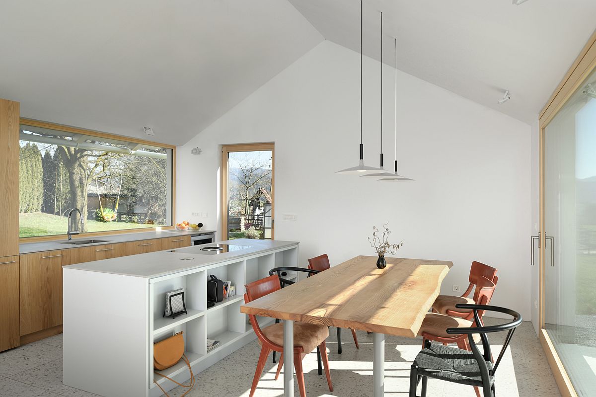 Wood and white kitchen and dining space with plenty of natural light