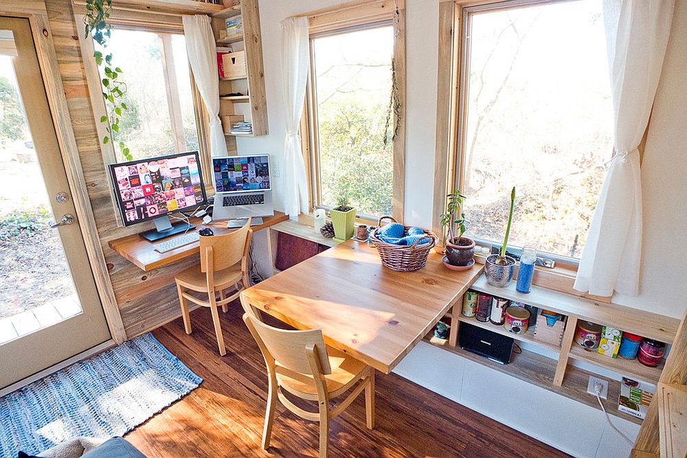 Wooden-fold-down-desks-turn-the-tiny-space-into-a-flexible-work-area-for-two-98571