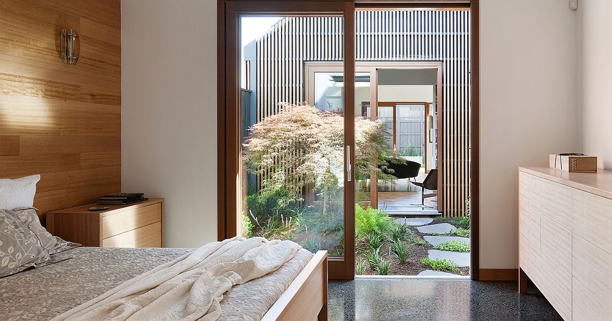 Bedroom of the house flows into the courtyard and offers a view of the home on other side