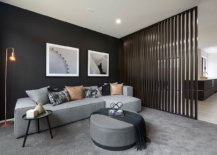 Black-wall-makes-for-a-lovely-backdrop-in-the-spacious-modern-living-room-with-gray-floor-and-decor-14859-217x155