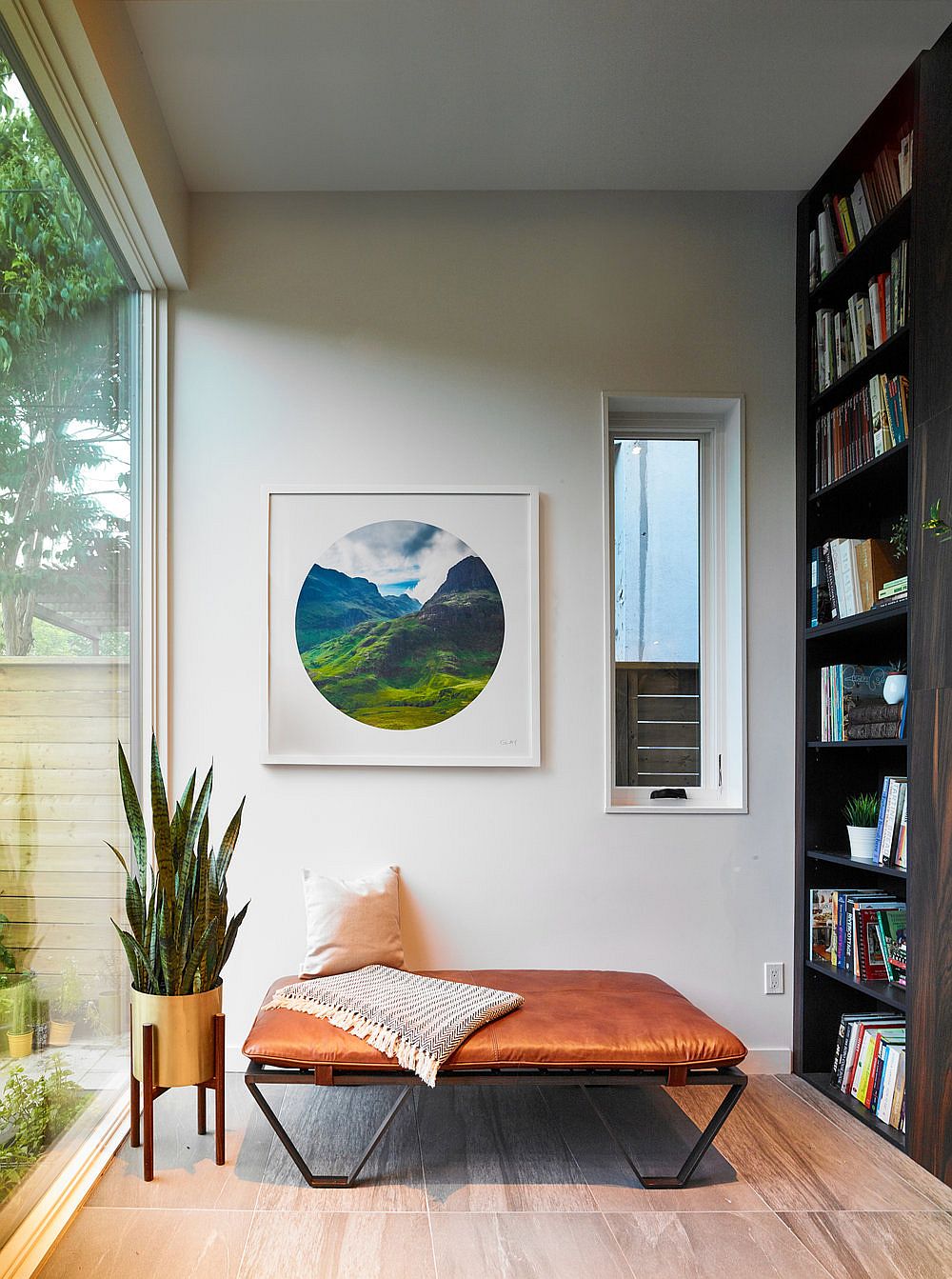 Bookshelf and lovely reading space with a view of the backyard