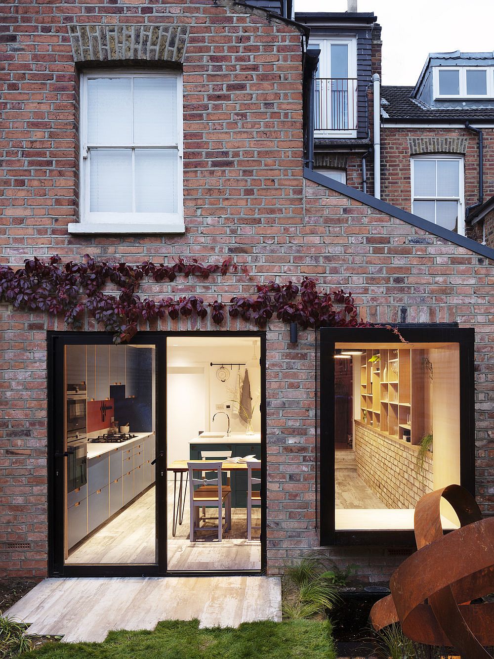 Brick and Glass extension of the Almington Street House gives the home new storage solutions