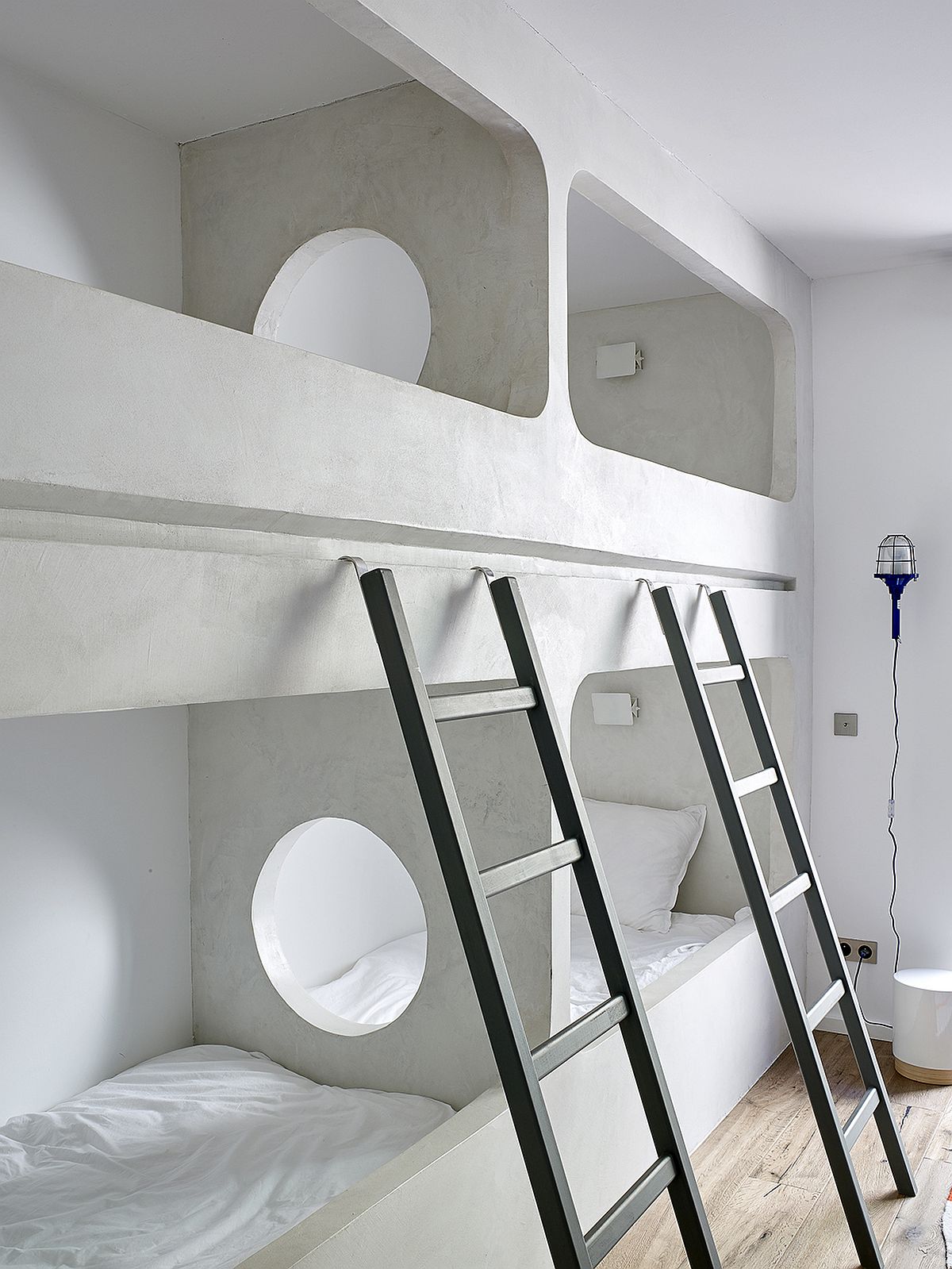 Bunk beds in the kids' room with ladder that feels both stylish and space-savvy