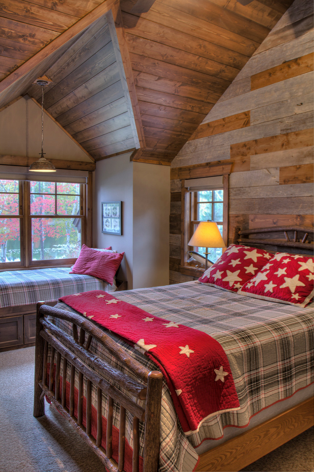 Cabin style bedroom with colorful bedding that adds much more than just bright hues