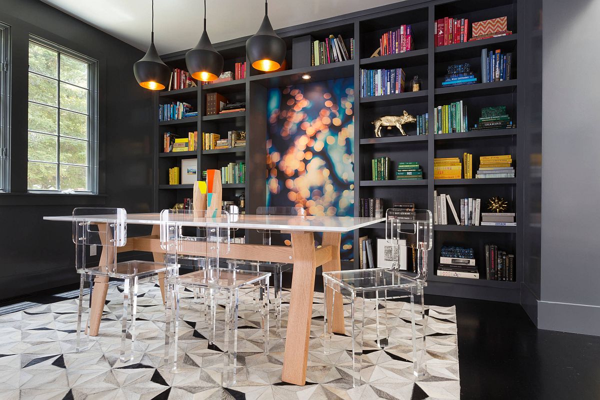 Colorful modern dining room with acrylic chairs, Tom Dixon pendants and a glossy black floor