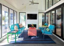 Colorful-sofa-in-blue-along-with-striped-chair-adds-eclectic-beauty-to-the-neutral-backdrop-in-this-sunroom-98901-217x155