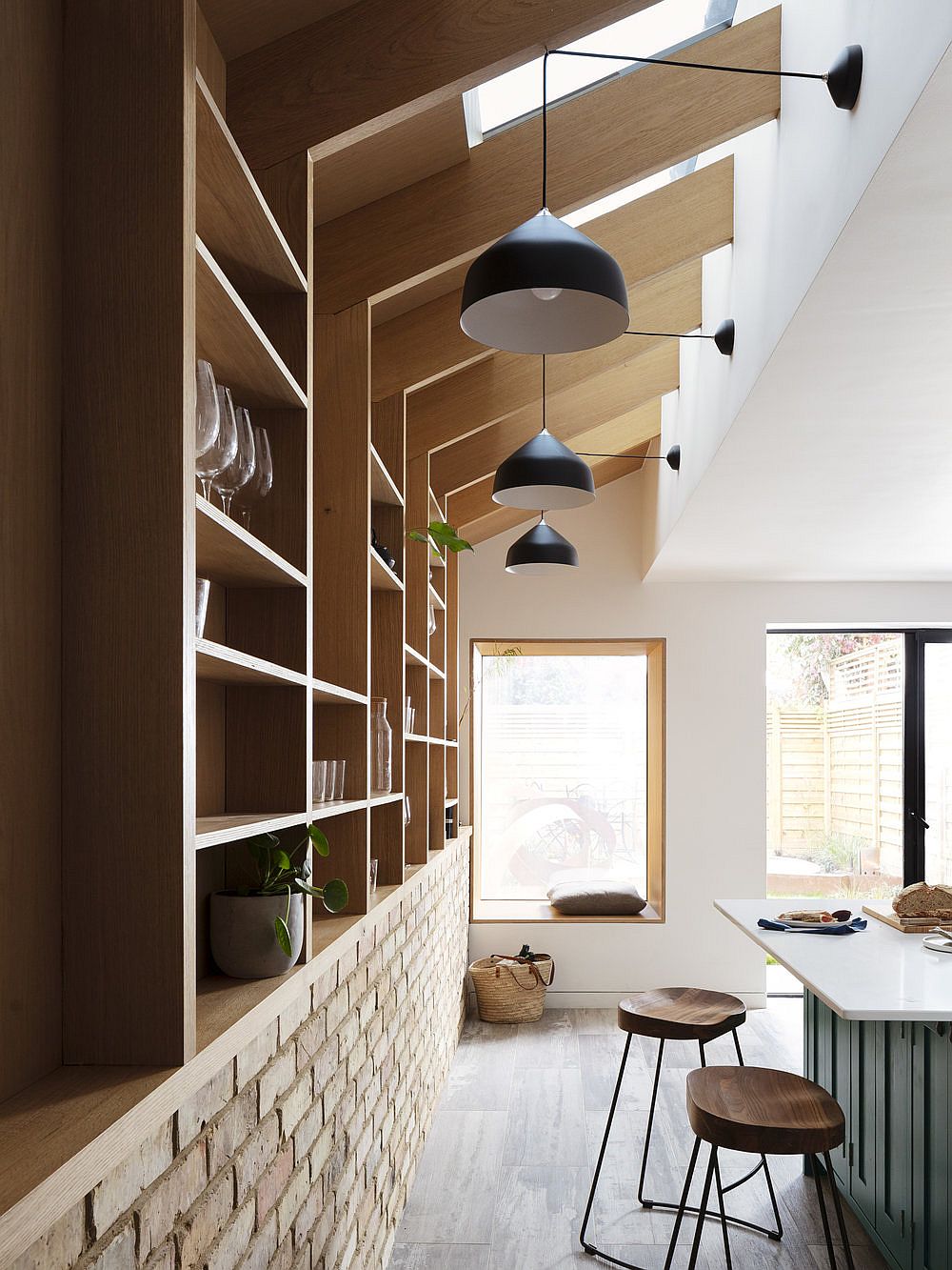 Combine natural light with gorgeous pendants in the kitchen for a more airy, inviting appeal