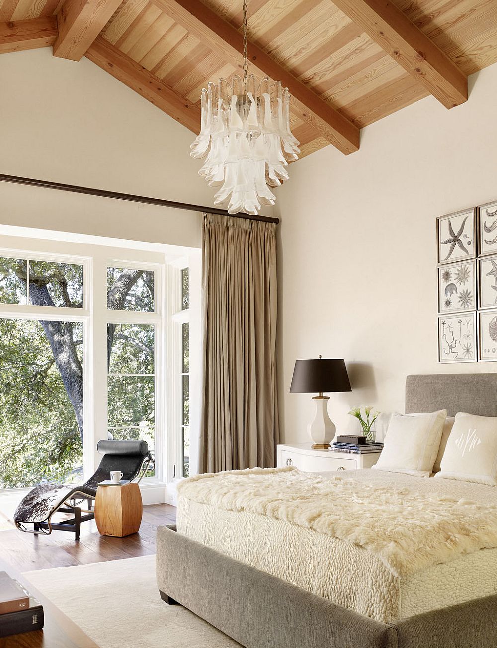 Curtains in brown separate the bedroom from the landscape outside