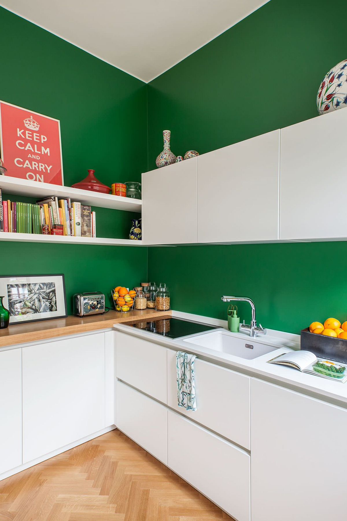 Dark green walls for the small Scandinavian style kitchen with white cabinets