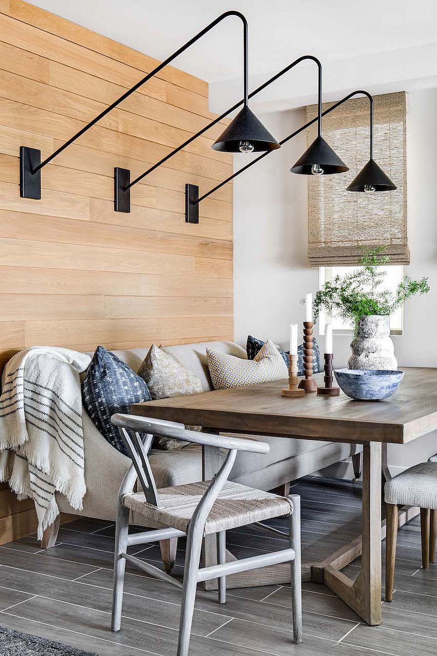 Dark sconce lighting fixtures for the small beach style dining area