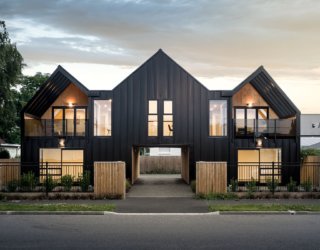 Gabled Building in Steel and Wood Houses Four Space-Savvy Single Bedroom Apartments