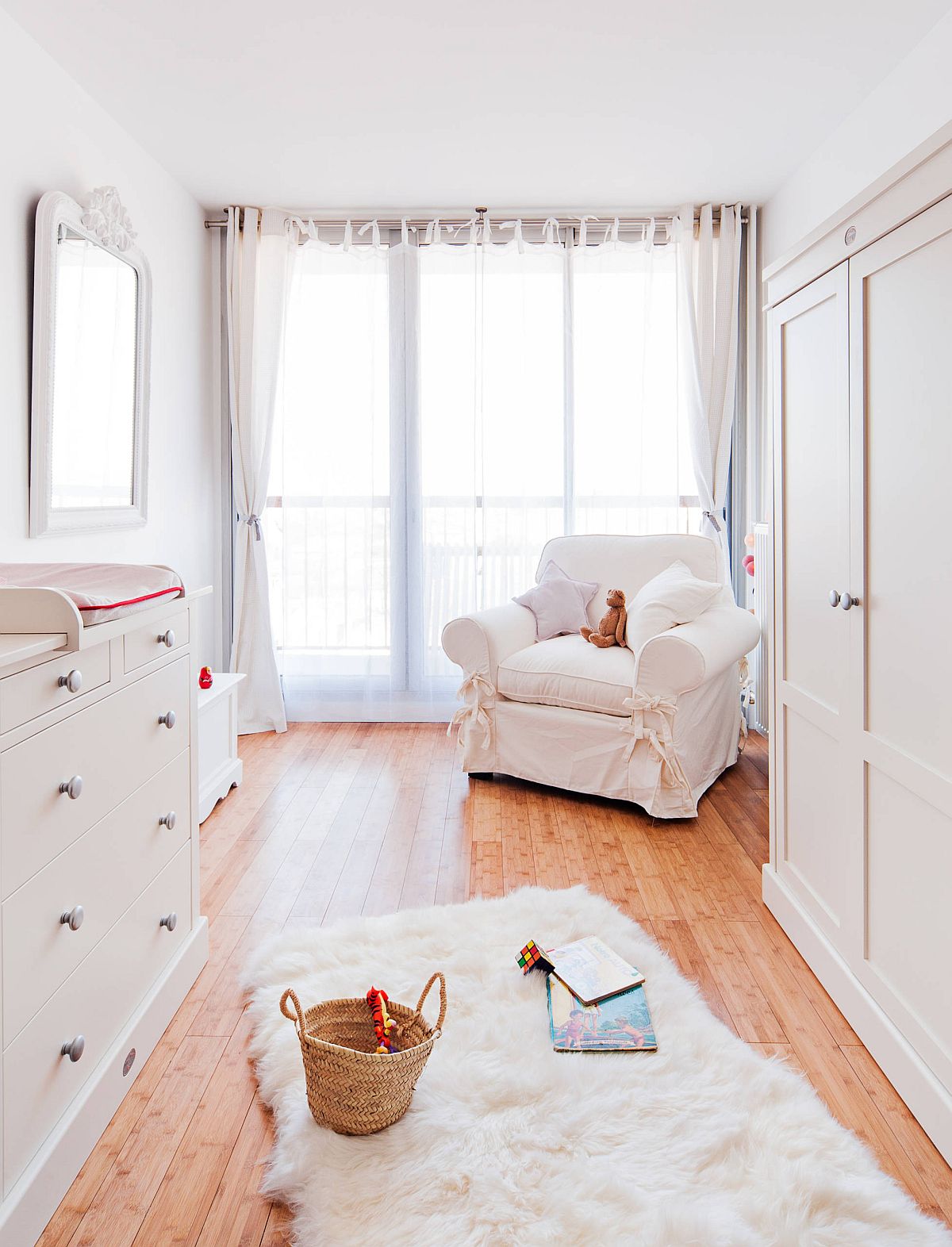 Dash of Parisian charm finds its way into this wood and white farmhouse style nursery