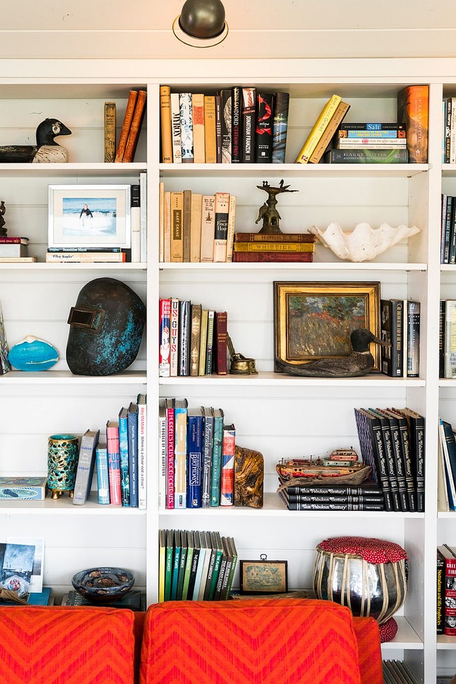 Decorating bookshelves inside the modern coastal home with books and more