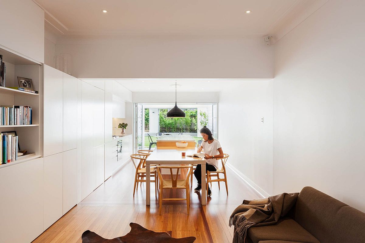 Dining space inside the house feels like a natural extension of the kitchen island