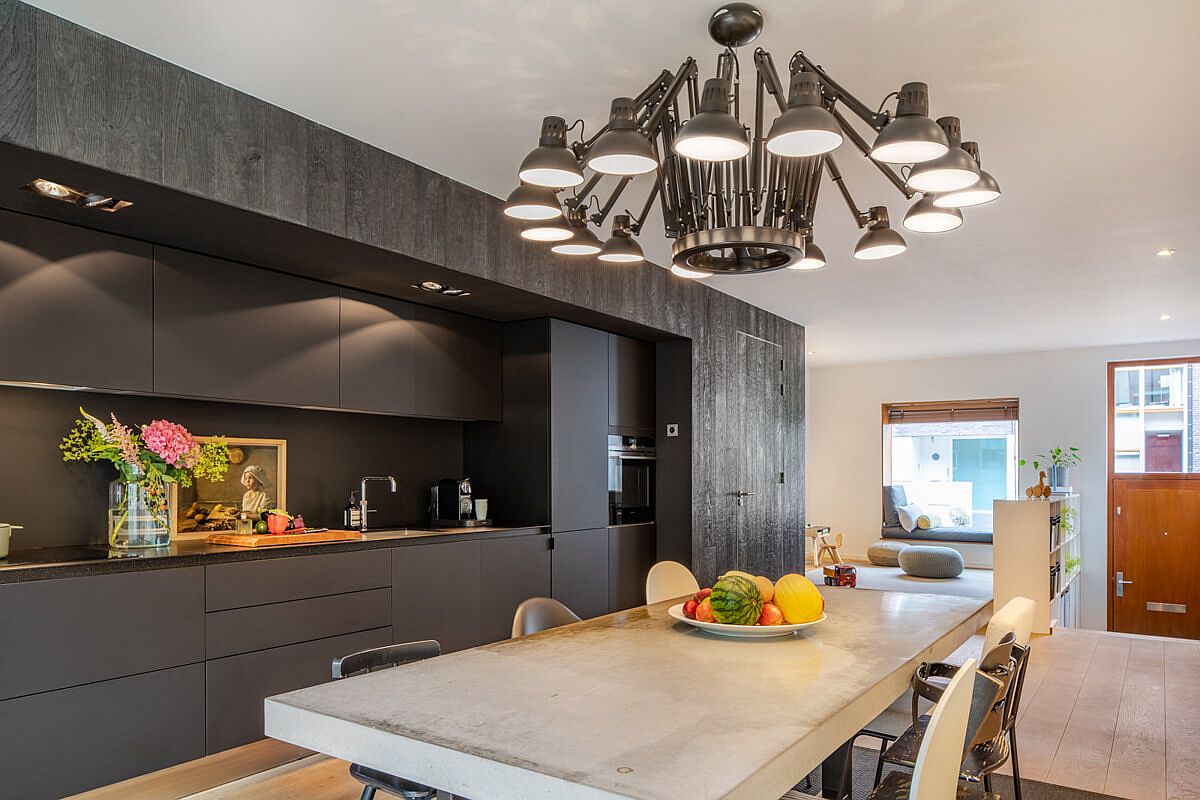 Dark gray and black paint a picture of sophistication in this Amsterdam kitchen