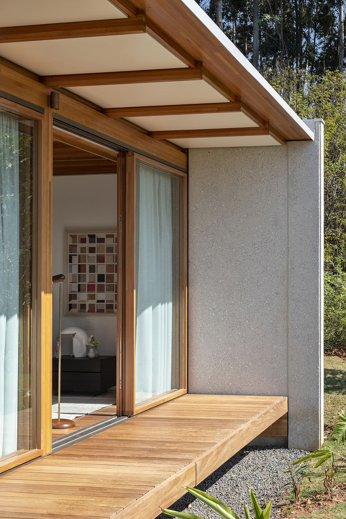 Drapes coupled with sliding doors allow those inside to switch between privacy and unabated views