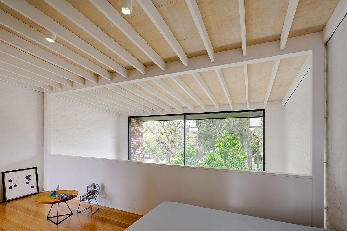 Ensuite on the top level with a view of the dining area below and the rear garden