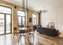 Exposed-brick-walls-and-arched-window-bring-a-sense-of-timeless-charm-to-the-modern-apartment-43033-217x155