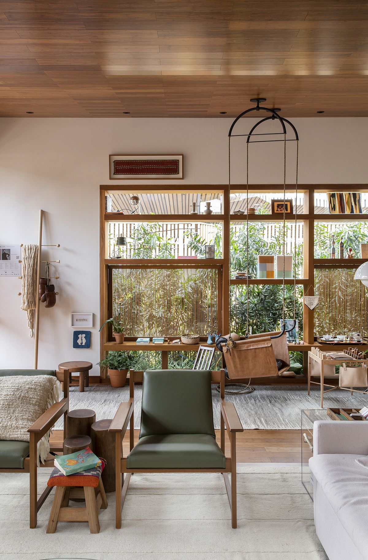 Fabulous hanging chair offers another sitting space inside this family room