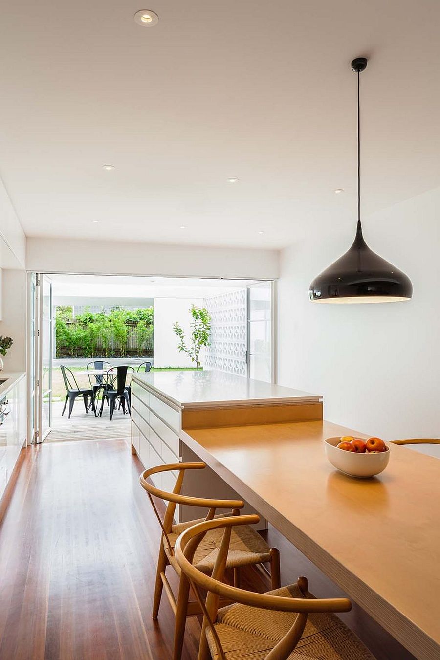 Fabulous kitchen and dining space of the revamped cottage with a large breakfast bar