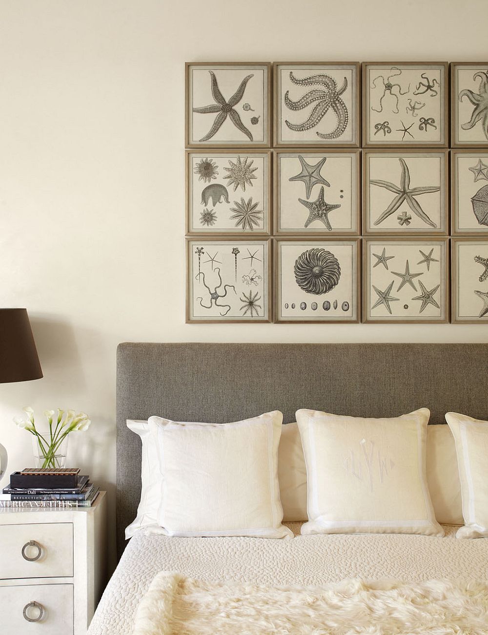 Framed natural prints serve as art work in this modern white bedroom