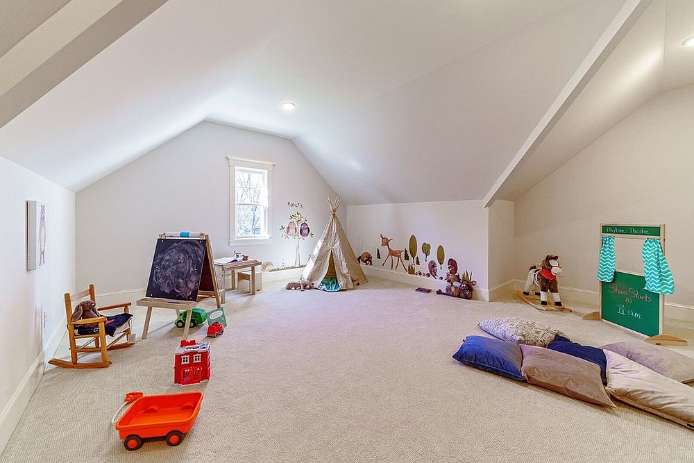 Large attic plaryroom that is carpeted feels both spacious and well-lit