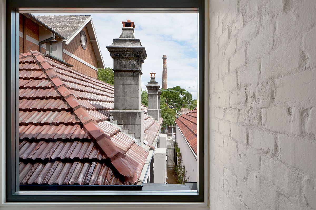 Large glass window on the upper level offers lovely views of the suburban neighborhood