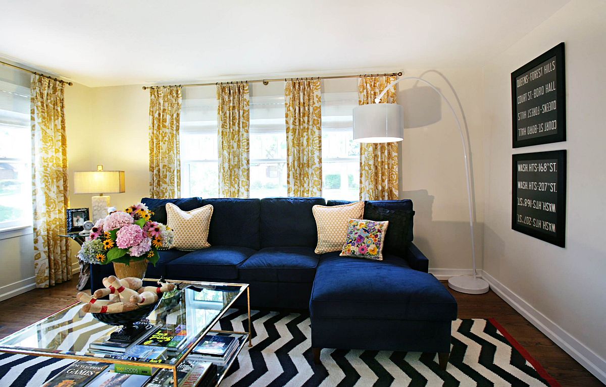 Large-sectional-in-blue-along-with-drapes-that-feature-yellow-pattern-add-color-to-the-interior-18513